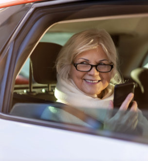 elder woman inside the car